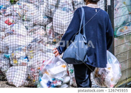 Yokohama cityscape, Japan. May. Collection day for plastic containers and packaging. Mountains of garbage piled up in the city. 126745935