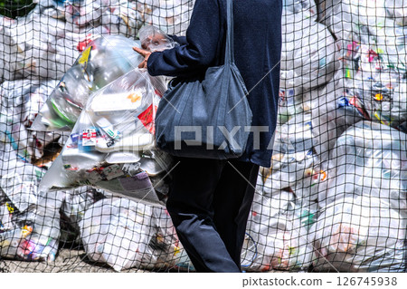 Yokohama cityscape, Japan. May. Collection day for plastic containers and packaging. Mountains of garbage piled up in the city. 126745938