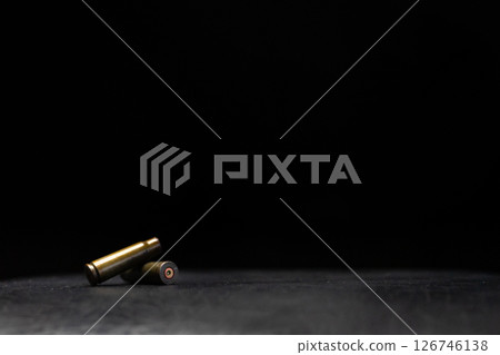 Minimalistic composition emphasizing military and dramatic elements with a focus on weaponry. 126746138