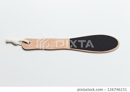 Wooden Heel scraper for foot peeling on white. Top view. Wooden Heel scraper for foot peeling on white. Top view. 126746231