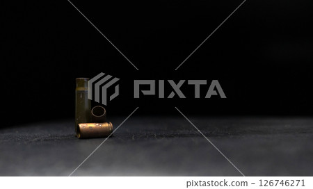 Minimalistic composition emphasizing military and dramatic elements with a focus on weaponry. Minimalistic composition emphasizing military and dramatic elements with a focus on weaponry. 126746271