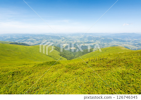 mountain landscape with meadow. scenic countryside in the valley. beautiful view from alpine hill in summer. rolling scenery with wide open vista 126746345