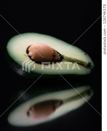 avocado on a black background avocado on a black background 126746378