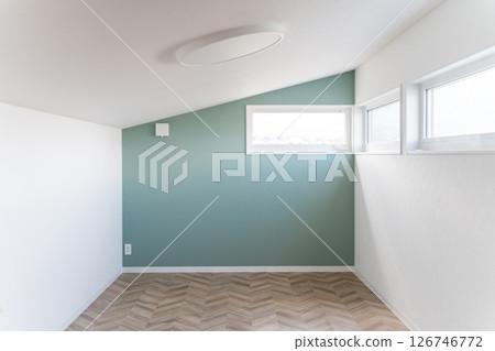 Attic room with a sloping roof 126746772