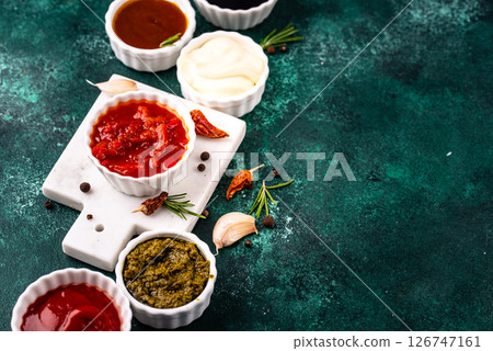 Set of different sauces. Ketchup, mustard, pesto 126747161