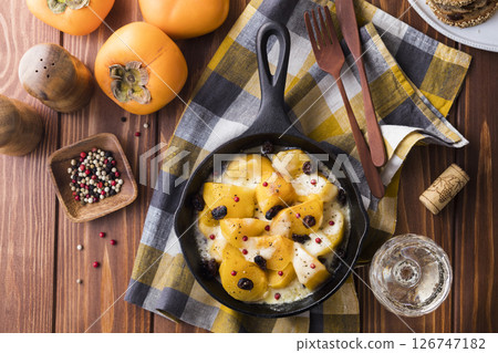 Roasted persimmon and mozzarella 126747182