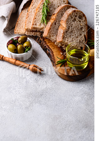Fresh bread, olive oil and mix of olives. Fresh bread, olive oil and mix of olives. 126747185