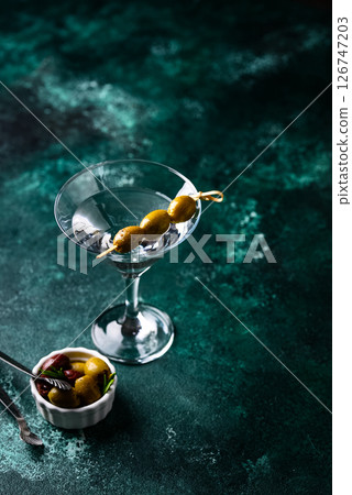 Traditional martini cocktail with olives and Traditional martini cocktail with olives and 126747203