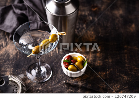 Traditional martini cocktail with olives and 126747209