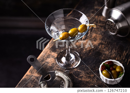 Traditional martini cocktail with olives and 126747210