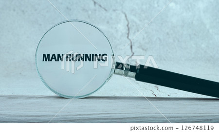 Business, customer, support, management concept. MAN RUNNING words through a magnifying glass on an abstract background Business, customer, support, management concept. MAN RUNNING words through a magnifying glass on an abstract background 126748119