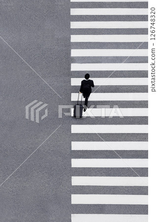 Man with luggage walking Crosswalk City street Business people lifestyle High angle view 126748320
