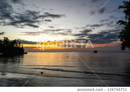 Sunset on Lia beach, Waleakodi Island, Togian archipelago, Sulawesi, Indonesia 126748752