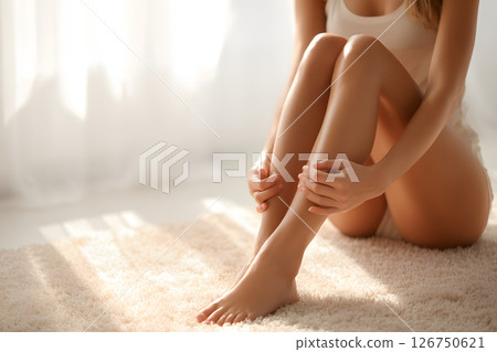 Beautifully illuminated female legs and relaxing scene with natural light Beautifully illuminated female legs and relaxing scene with natural light 126750621