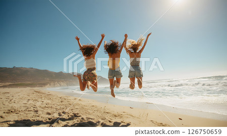 Three women jumping on the beach. A moment of freedom and joy 126750659