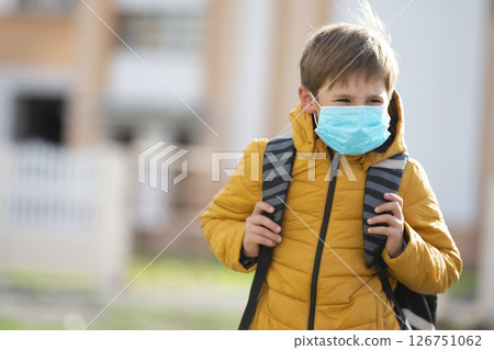 A masked child goes to school after being quarantined and isolated from the coronavirus. A masked child goes to school after being quarantined and isolated from the coronavirus. 126751062