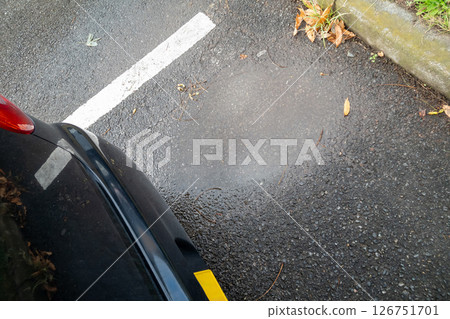 Puddle in the parking lot 126751701