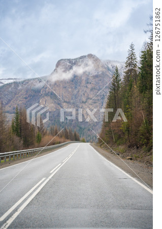 Mountain road and valley of Chuysky Trakt Altai Russia. Scenic route through rugged terrain and expansive natural landscape 126751862