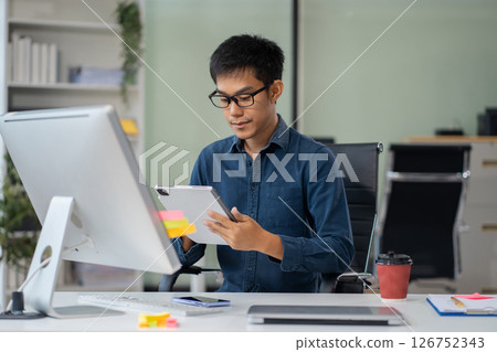Male businessman are sitting searching for information in office. Male businessman are sitting searching for information in office. 126752343