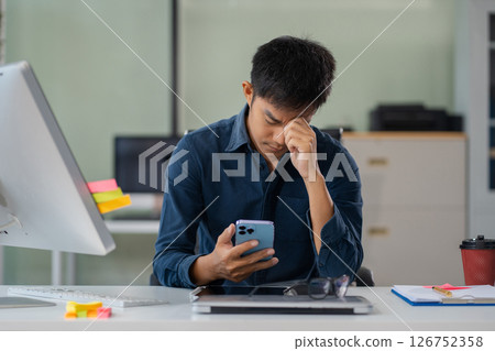 Businessman talking on the phone giving professional consultation to client or negotiating project. problems highlighting customer dissatisfaction. Businessman talking on the phone giving professional consultation to client or negotiating project. problems highlighting customer dissatisfaction. 126752358