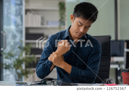 Business men have wrist pain after work hard in office feeling so pain and illness with Office syndrome symptom, healthcare office syndrome concept. 126752367