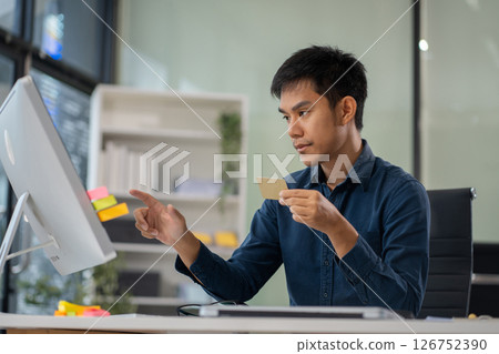 Male businessman use credit card to shopping online. Male businessman use credit card to shopping online. 126752390