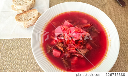 Steaming borscht with beef and bread in prague restaurant Steaming borscht with beef and bread in prague restaurant 126752888