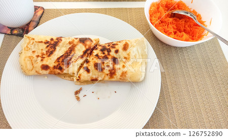 Freshly cooked pancakes with grated carrots and coffee enjoyed in prague Freshly cooked pancakes with grated carrots and coffee enjoyed in prague 126752890