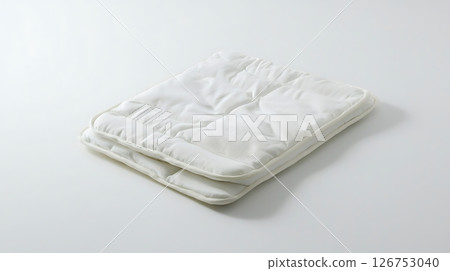 A white blanket with a pattern on it 126753040