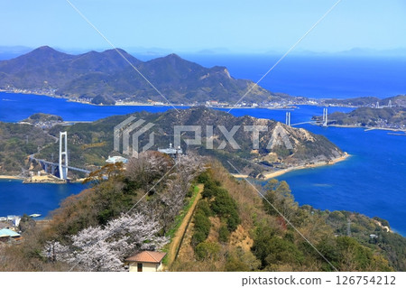 [Ehime Prefecture] Yumeshima Kaido (Iwaki Bridge and Ikina Bridge) seen from Mount Sekizen with cherry blossoms in bloom 126754212