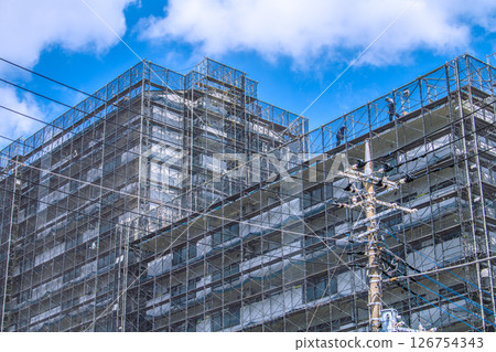 Yokohama cityscape in Japan - Apartment building repairs and inspections, scaffolding and protective netting 126754343
