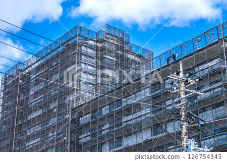 Yokohama cityscape in Japan - Apartment building repairs and inspections, scaffolding and protective netting 126754345