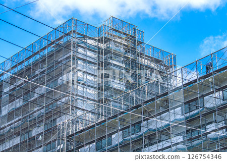 Yokohama cityscape in Japan - Apartment building repairs and inspections, scaffolding and protective netting 126754346