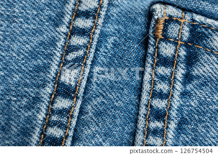 Macro fabric texture of cotton blue jeans. Pocket and thread stitching Macro fabric texture of cotton blue jeans. Pocket and thread stitching 126754504