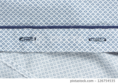 One hundred percent cotton clothing, macro holes for buttons on shirt 126754535