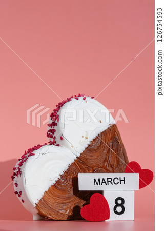 8 March international women's day Heart shaped white chocolate croissant on pink background with copy space. Puff pastry new trendy sweet dessert bakery. Creamy dough 126754593