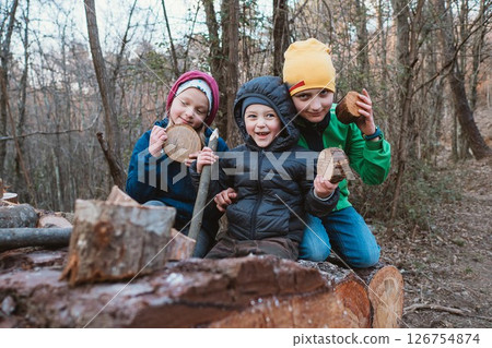 Children Playing in Forest with Wood Pieces 126754874