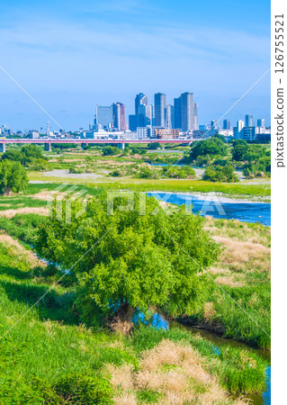 Tokyo cityscape in Japan on May 28th... View of Tama River and tower apartment complexes in front of Kawasaki and Musashi-Kosugi stations = Reiwa 7 126755521