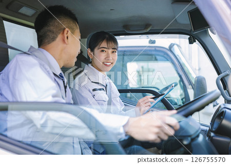 Delivery staff driving a truck 126755570