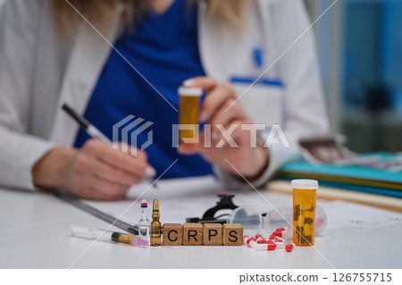 A Healthcare Professional Engaged in Thorough Analysis of CRPS Treatment Options Available A Healthcare Professional Engaged in Thorough Analysis of CRPS Treatment Options Available 126755715