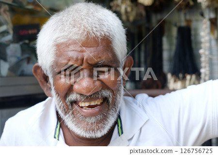 A Joyful Elderly Man Smiling Happily While Enjoying the Outdoors on a Beautiful Day A Joyful Elderly Man Smiling Happily While Enjoying the Outdoors on a Beautiful Day 126756725