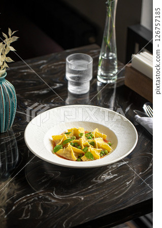 Portion of italian ravioli dumplings dish Portion of italian ravioli dumplings dish 126757185