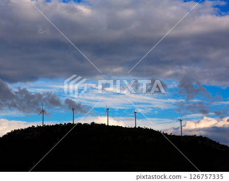 Sunset mountain with electric windmills Sunset mountain with electric windmills 126757335