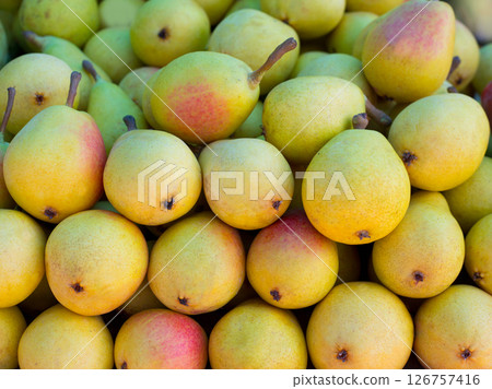 pears fruits stacked in a row on market 126757416