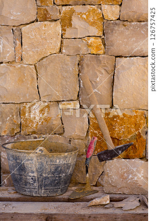 Hammer tools of stonecutter masonry work 126757425