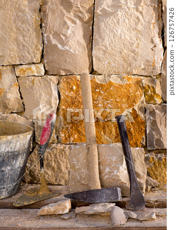 Hammer tools of stonecutter masonry work 126757426