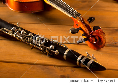 Classic music violin and clarinet in vintage wood Classic music violin and clarinet in vintage wood 126757461