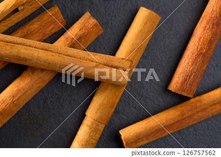 Cinnamon spice macro closeup detail on black Cinnamon spice macro closeup detail on black 126757562