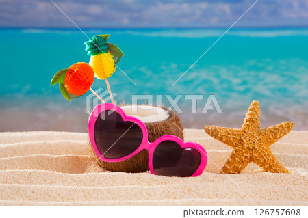 Coconut cocktail on tropical  sand beach heart sunglasses 126757608