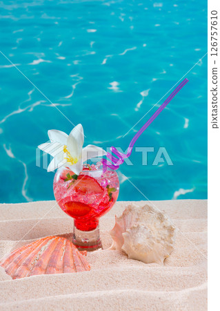 tropical red cocktail on caribbean sand flower and seashell 126757610